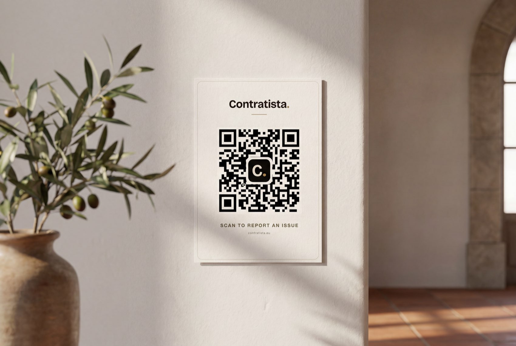 A Contratista QR card on the wall inside a Spanish villa